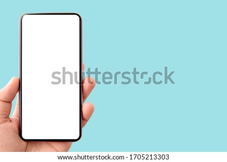 Mockup image of mobile phone with blank white screen isolated on Blue background to do list and office notice or information board with appointment notes