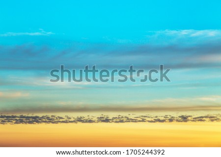 Colorful pantone sunset divided by clouds in small horizontal lines Royalty-Free Stock Photo #1705244392