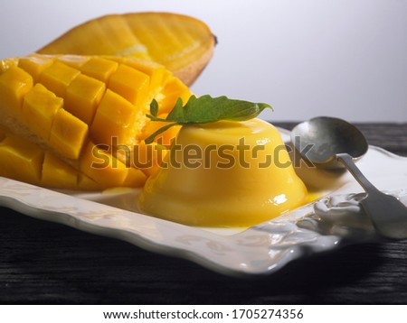 Mango pudding, jelly, dessert on white plate