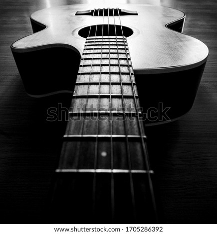 Close up detail of classic guitar with shallow depth of field with dark tone concept