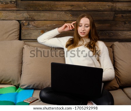Photo of student freelancer girl with laptop at home interior