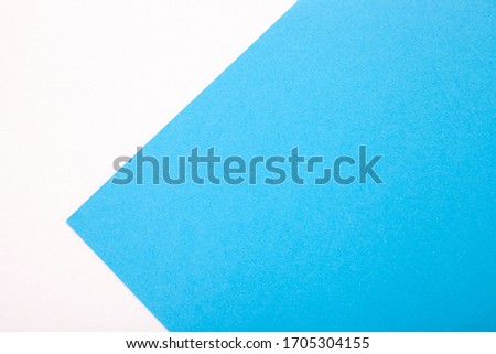 White and blue pastel paper texture as background. Top view with place for text