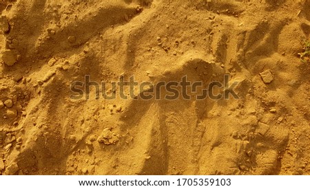 sand surface in brown color close up background texture photo