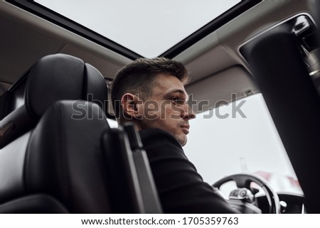 Cropped photo of young businessman renting car. Rent and trade-in concept