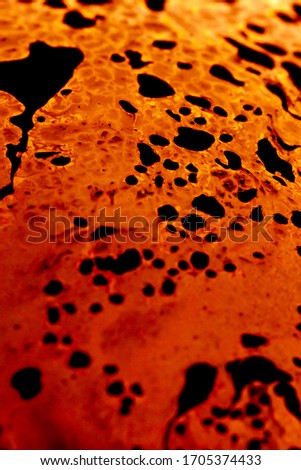 Orange black surface like volcano fire macro