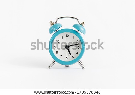 Blue alarm clock on white background. Time and deadline concept