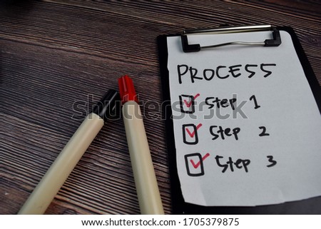 Process write on sticky notes and step task checklist isolated on the table.