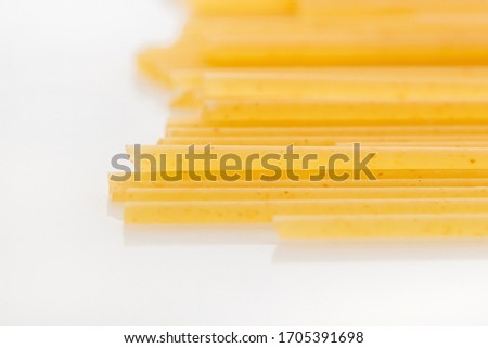 Raw uncooked spaghetti isolated on white background