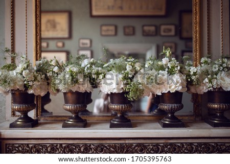 Flowers on on the dresser. Chenonceaux castle. Decor.