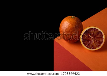 abstract geometric image of red orange on illusionary cube on black background