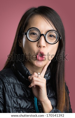 Woman with funny face over red background