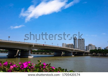 Guangzhou Bridge under blue sky and white clouds