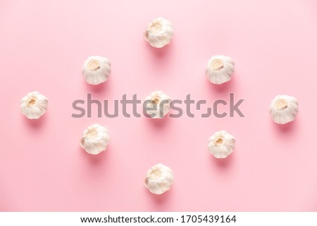 sharp and gentle garlic pattern on a pink background on top