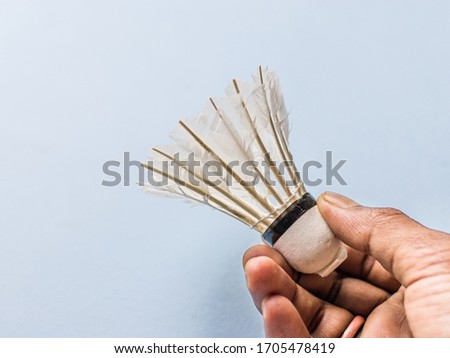 White Feather Shuttlecock with light blue a colour background stock isolated image. 