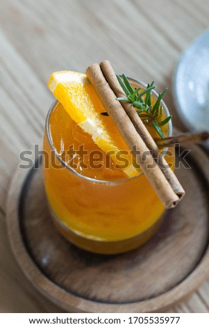 orange juice on wooden table 