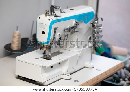 A specialized sewing machine for entrepreneurs who have large orders for fabric. Royalty-Free Stock Photo #1705539754