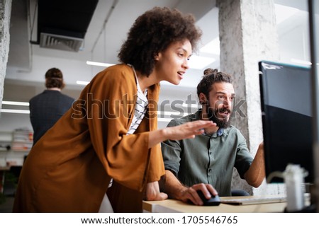 Group of business people collaborating on project in office