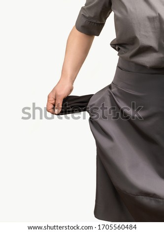 Woman is holding empty pockets on her clothes, isolated on white background.