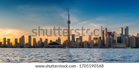 Skyline of Toronto City panorama with CN Tower over Ontario Lake, Toronto, Canada.	