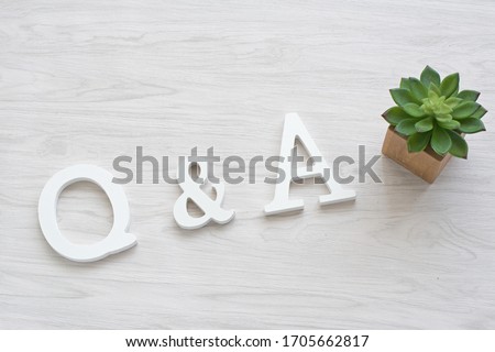  Q and A white wooden alphabet on table,Q&A,FAQ concept. Royalty-Free Stock Photo #1705662817