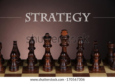 Chess board with chess pieces on dark color background