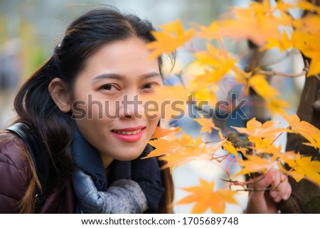 Asian woman and red maple  in autumn of Nikko, Japan