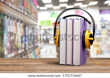 Study book with headphones, audio book concept