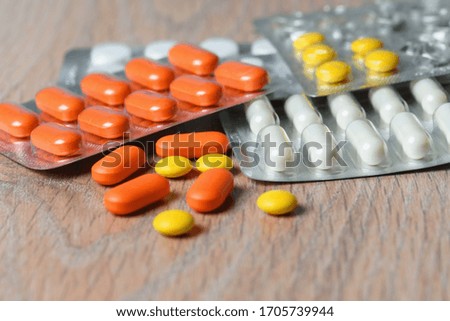 Close-up of tablet packages on the table. Concept of protection and treatment of coronavirus infection.