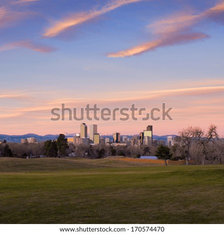 Scenic sunrise with pink clouds over downtown Denver, Colorado. Super wide angle.