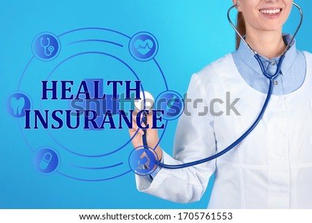 Phrase Health Insurance, icons and doctor with stethoscope on blue background, closeup