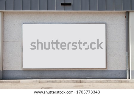 Blank billboard on street wall