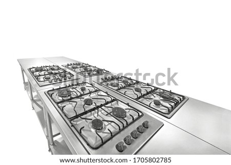 Perspective view of professional industrial kitchen furniture against white empty background.