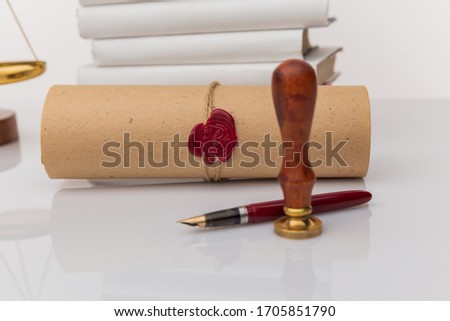 Notary public wax stamper and wax seal on document