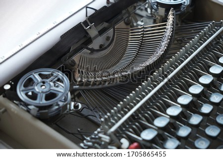Mechanism and keyboard of an old typewriter with film coil