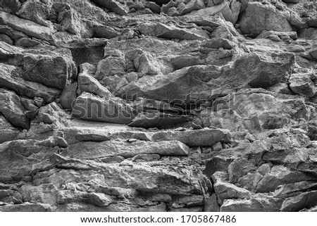 Gray texture cut blocks trench. Mining cliff of rough rock crash surface. Coarse detail quarry backdrop. Heavy grunge damage natural wall cave. Crack antique medieval marble front facade for design 3d