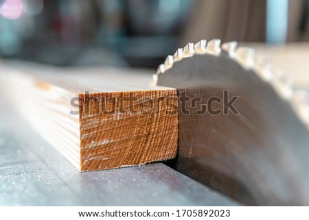 toothed metal blade on circular saw in joinery Royalty-Free Stock Photo #1705892023