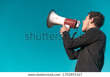 megaphone as a tool for loud communication of important news and information. Copy space. Isolated Royalty-Free Stock Photo #1705892167