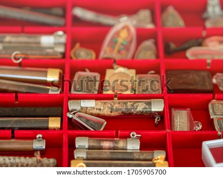 Soft focus picture of stand, booth, stall or compartment for sale any type of thai amulets in the market.