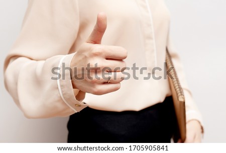 Business woman hand with thumb up. Female hand showing OK. Good job