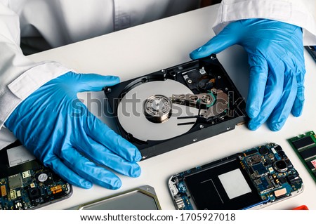 data hard drive backup disc hdd disk restoration restore recovery engineer work tool virus access file fixing failed profession engineering maintenance repairman technology concept Royalty-Free Stock Photo #1705927018