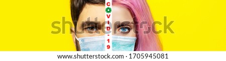 Collage of studio half face portraits of young woman and man, wearing safety medical flu mask against coronavirus. Isolated on yellow background. Covid-19 text between pictures.