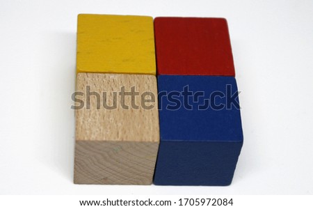 Wooden square made of small colored cubes