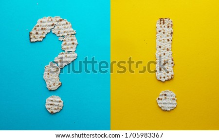 pesach concept, creative matza; 'ma nistana' song in Passover Haggadah, Question mark and exclamation point made of matzah crises
 Royalty-Free Stock Photo #1705983367