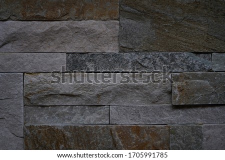 grey smoky wall coverings in the form of natural stone for facing, landscape, interior.