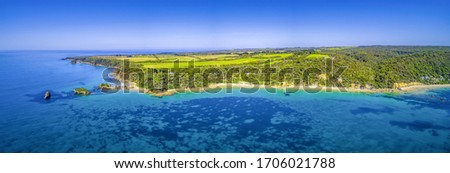Picturesque coastline and farmlands in Victoria, Australia - wide aerial panorama