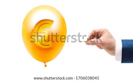 Businessman's hand holding needle that pierces flying golden balloon with euro sign. Clipping path. Bankruptcy, economic crisis concept