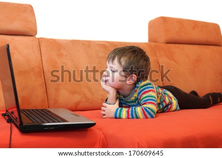 boy is watching a computer screen