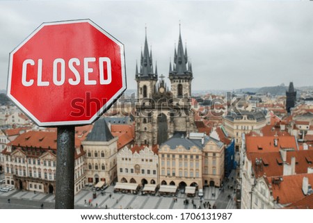 Closed, close stop sign with view of Prague, Czech. Closed facilities because of corona virus. COVID-19 pandemic quarantine.