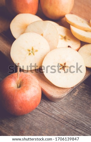 Close-up apples on the rustic wooden background. Selective focus. Shallow depth of field.
