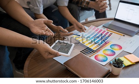 Graphic design and color swatches and pens on a desk. Architectural drawing with work tools and accessories.